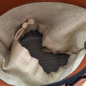 Iam never used it's small crossbody beautiful tan color